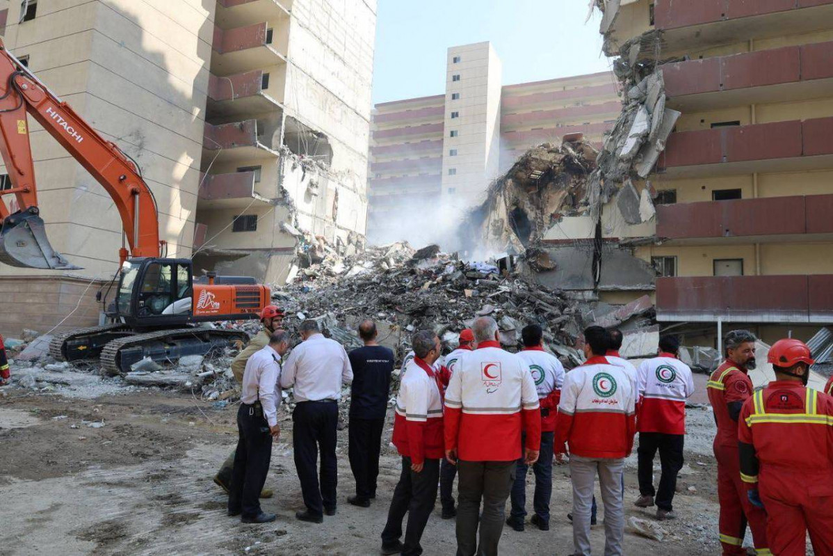 EuropaPress 6798982 june 14 2025 tehran iran rescue teams are working outside building that was