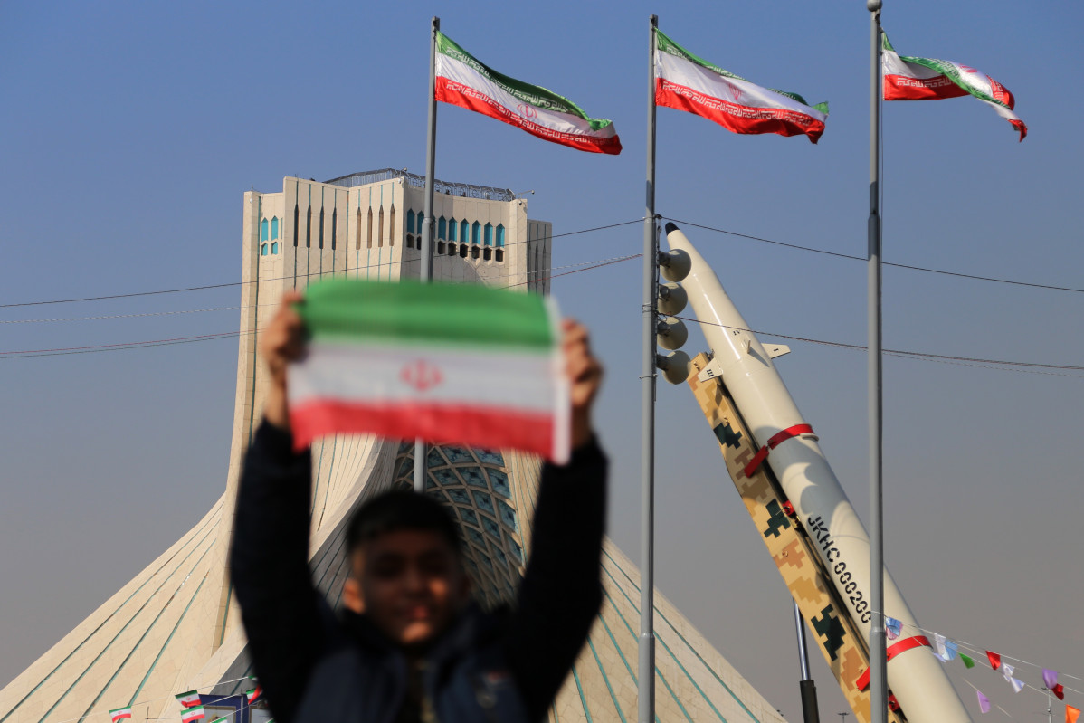 EuropaPress 7417209 february 11 2024 tehran iran an iranian boy holds an iranian flag near the