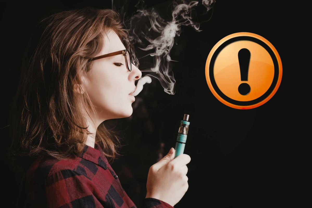 Alerta, una mujer vapeando   RECURSO   CANVA