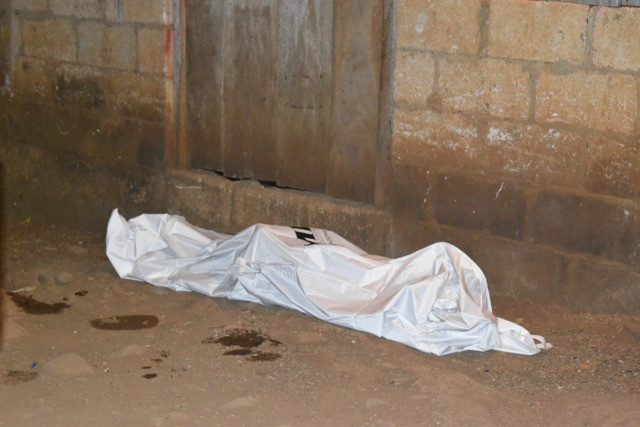 Cos de la defensora Dominga Ramos, en el lloc de l'assassinat. MCQ