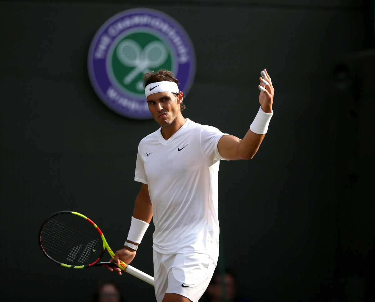 10 July 2019, England, London: Spanish tennis player Rafael Nadal reacts during his men s singles quarter-final matx against US Sam Querrey on day nine of the 2019 Wimbledon Gran eslam tennis tournament at the All England Lawn Tennis and Croquet Club. ph