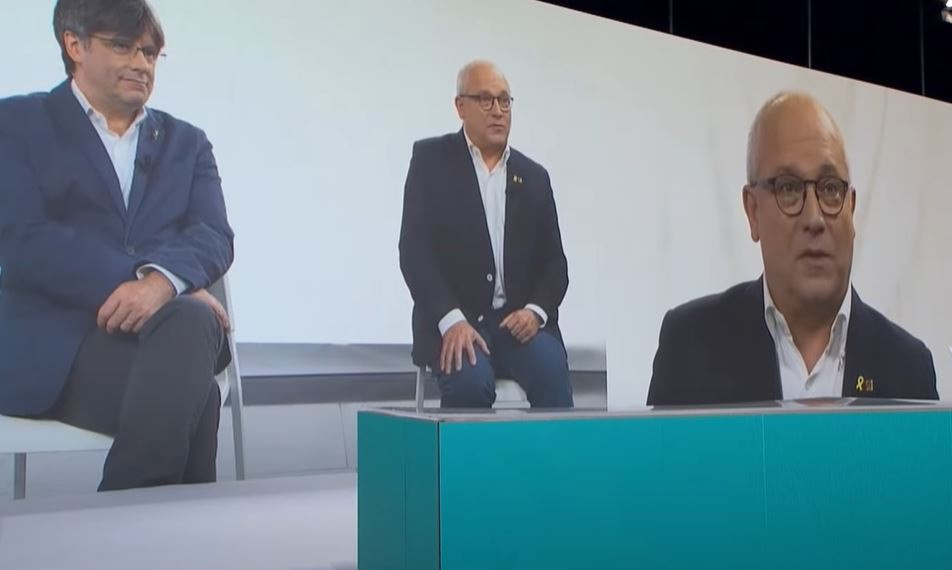 L'exconseller Lluís Puig, elegit president de la Taula de l'congrés de el nou JxCat, intervé en l'acte de presentació de el partit.